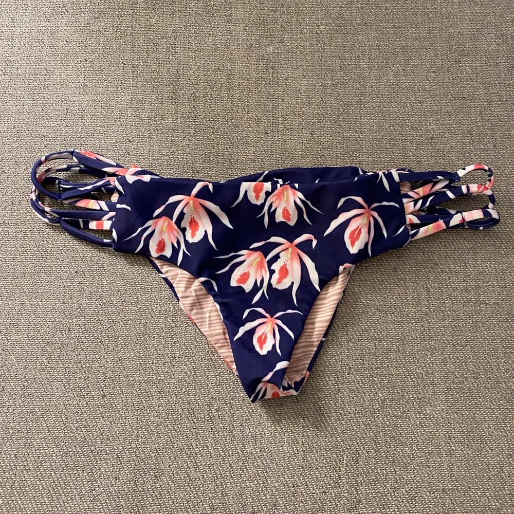 Acacia dark purple and pink floral bottoms with stringy lattice type side cutout